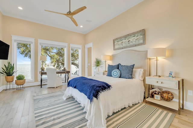 bedroom featuring light hardwood / wood-style flooring and ceiling fan