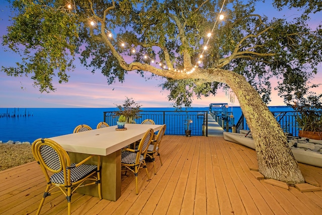 deck at dusk with a water view