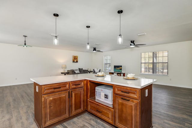 kitchen featuring pendant lighting, dark hardwood / wood-style floors, and a kitchen island