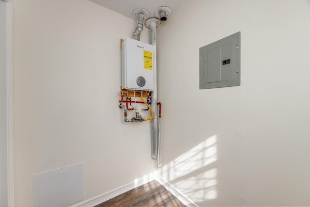 utilities featuring tankless water heater and electric panel