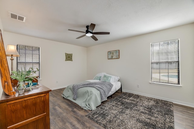 bedroom featuring dark wood-type flooring and ceiling fan