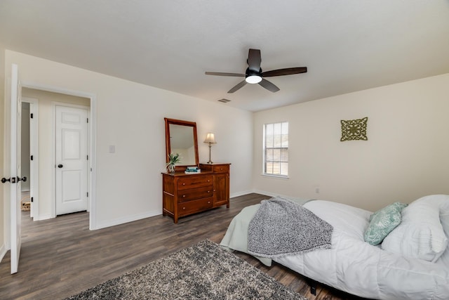 bedroom with dark wood-type flooring and ceiling fan