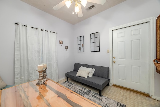 sitting room featuring ceiling fan