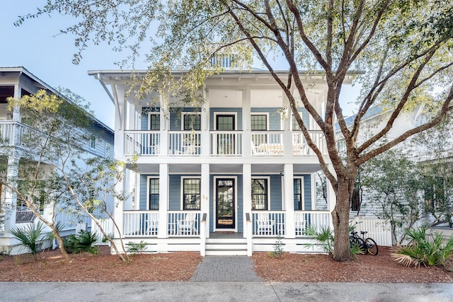 view of front facade featuring a porch and a balcony