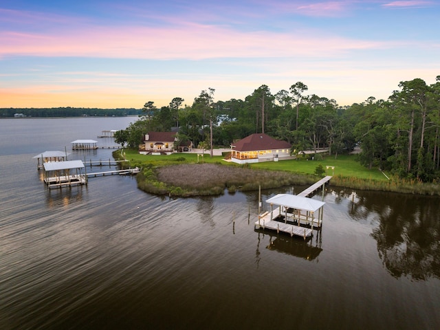 aerial view at dusk with a water view