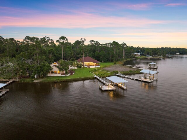 aerial view at dusk with a water view