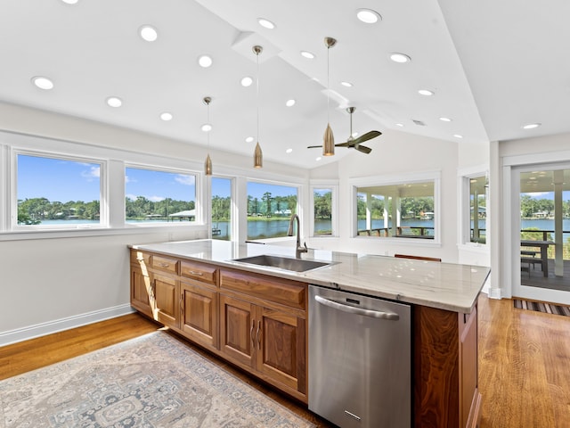 kitchen with ceiling fan, dishwasher, light wood-type flooring, pendant lighting, and sink