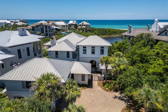 birds eye view of property with a water view and a residential view