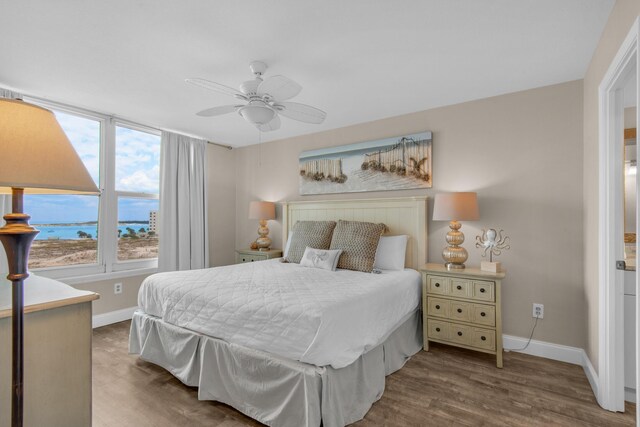 bedroom featuring ceiling fan and hardwood / wood-style floors