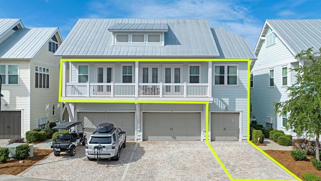 view of front of house with a balcony and a garage