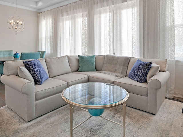 living room with plenty of natural light and a chandelier