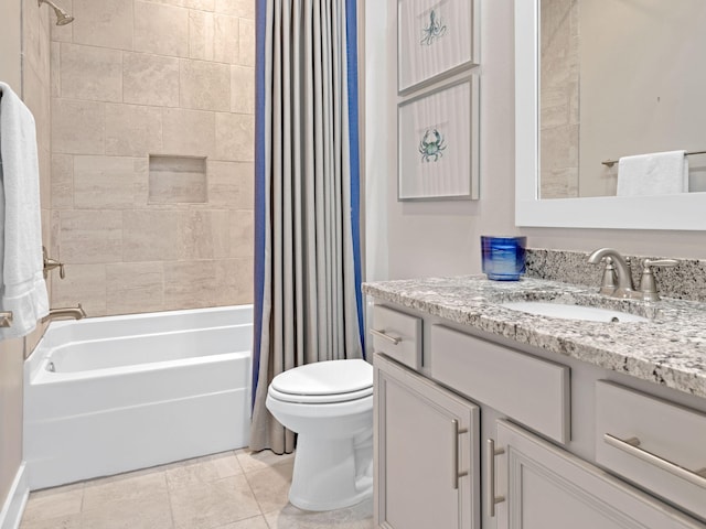 full bathroom with tile patterned floors, vanity, toilet, and shower / bath combo with shower curtain