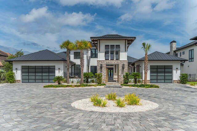 view of front of property with a garage and a balcony