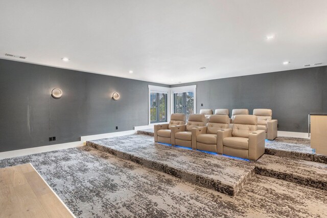 cinema room featuring hardwood / wood-style floors