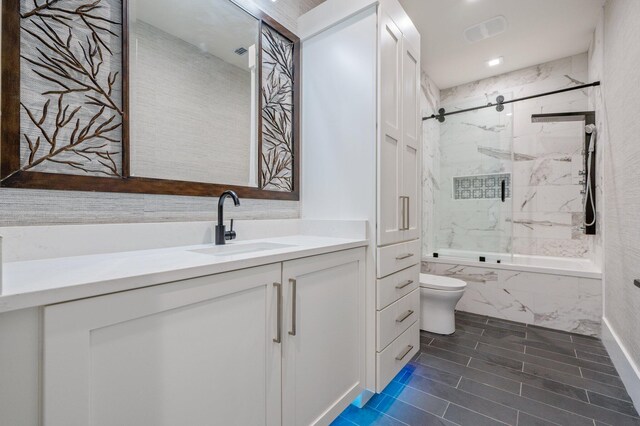 full bathroom with vanity, toilet, and tiled shower / bath