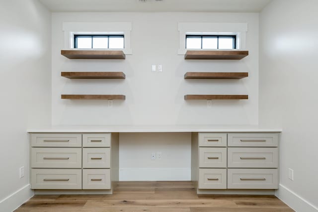 interior space featuring a wealth of natural light and wood-type flooring