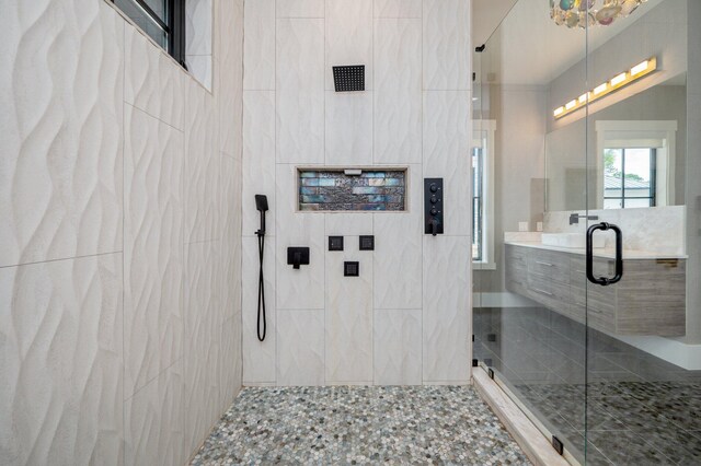 bathroom with vanity and an enclosed shower