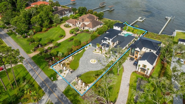 birds eye view of property with a water view