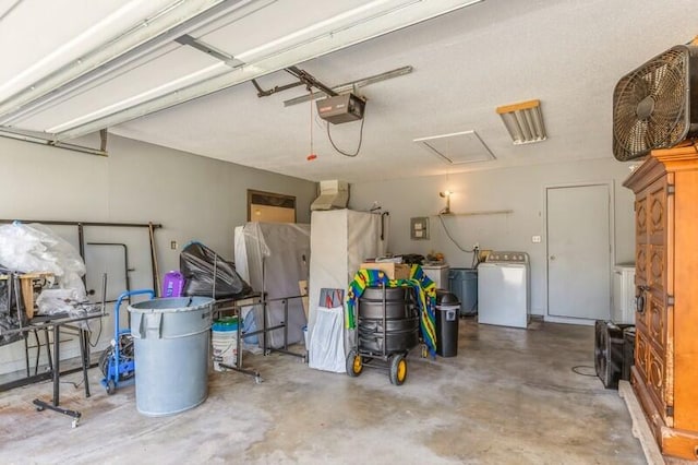 garage with washer / dryer and a garage door opener