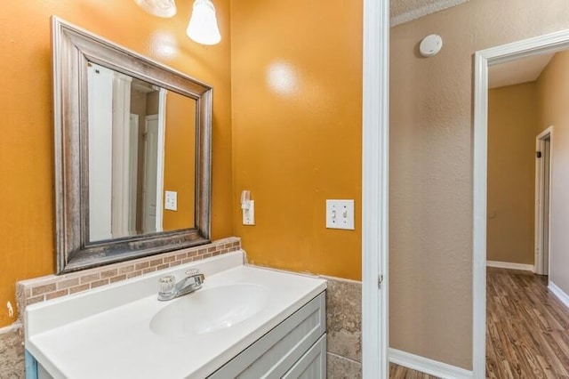 bathroom featuring hardwood / wood-style floors and vanity