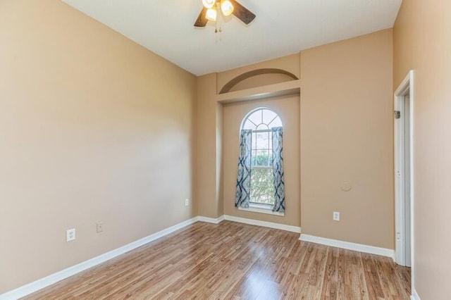 spare room with ceiling fan and light hardwood / wood-style flooring