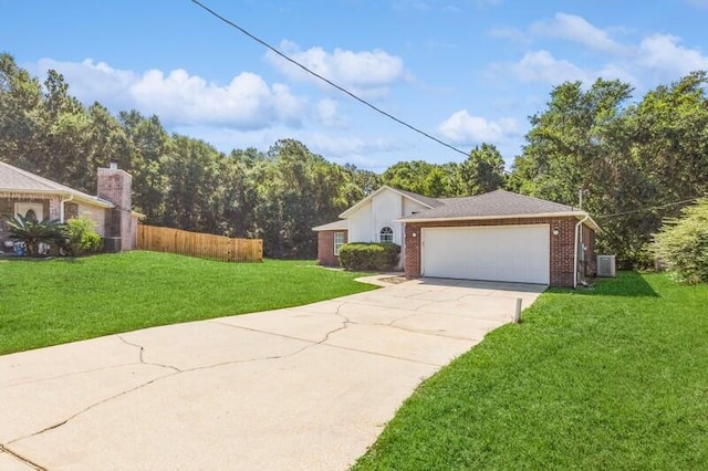 ranch-style home featuring a garage and a front lawn