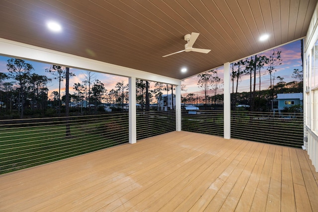 wooden deck with a ceiling fan