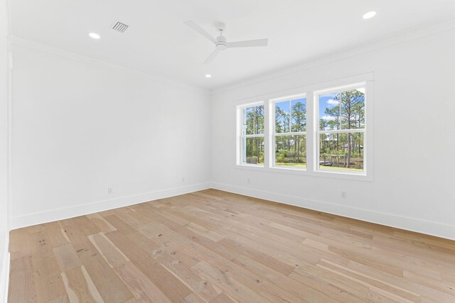 unfurnished room featuring light wood-type flooring, baseboards, crown molding, and recessed lighting