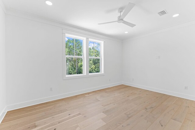 unfurnished room featuring crown molding, recessed lighting, visible vents, light wood-style floors, and baseboards