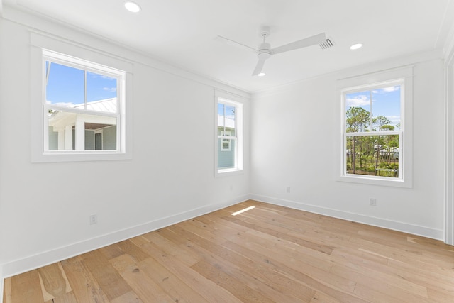 spare room featuring light wood-style floors, baseboards, a ceiling fan, and recessed lighting