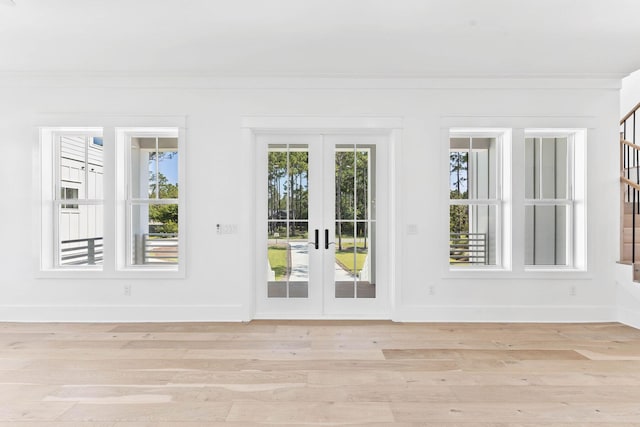 doorway featuring french doors and light wood-type flooring