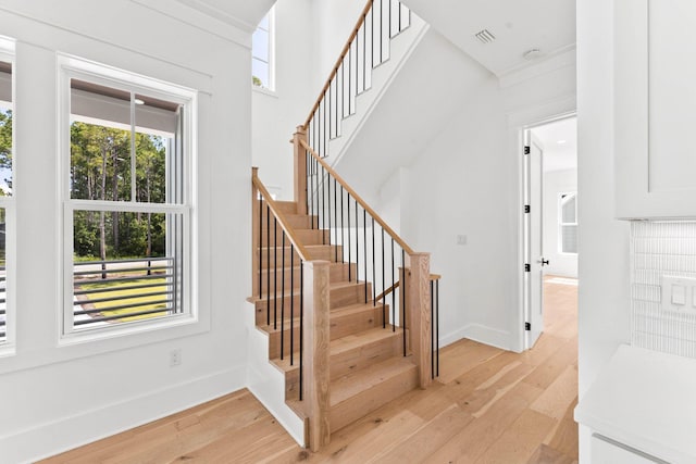 staircase with light wood-type flooring