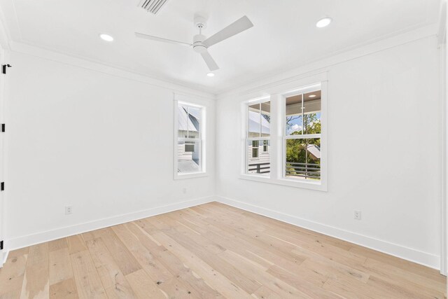 unfurnished room with light hardwood / wood-style floors, crown molding, and ceiling fan