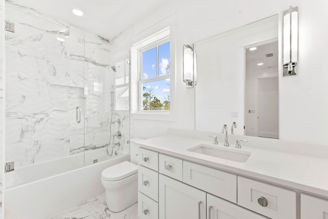 full bathroom with tile patterned flooring, bath / shower combo with glass door, toilet, and vanity