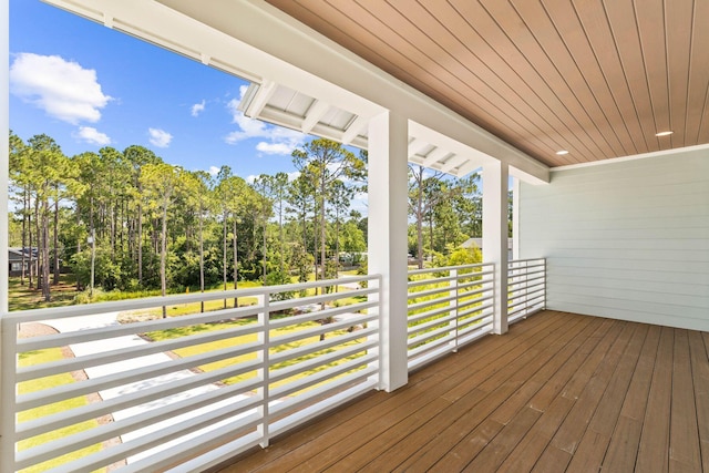 109 W Nursery Rd, Santa Rosa Beach, FL 32459 - wooden deck with covered porch and view of scattered trees