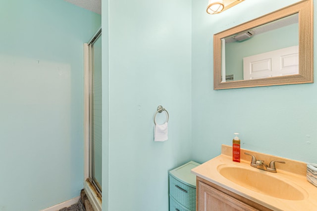 bathroom with a textured ceiling and oversized vanity