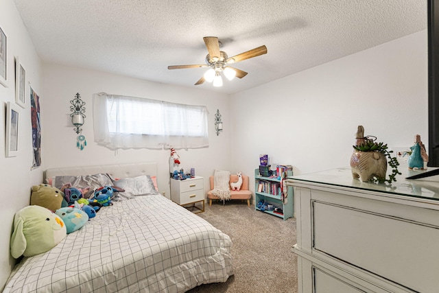 carpeted bedroom featuring a textured ceiling and ceiling fan