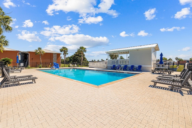 view of swimming pool with a patio area