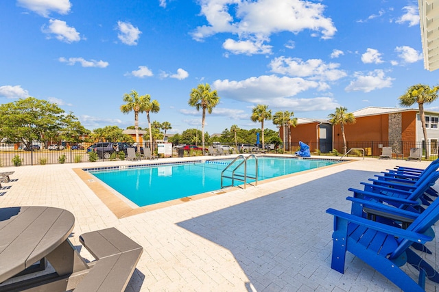 view of swimming pool with a patio area