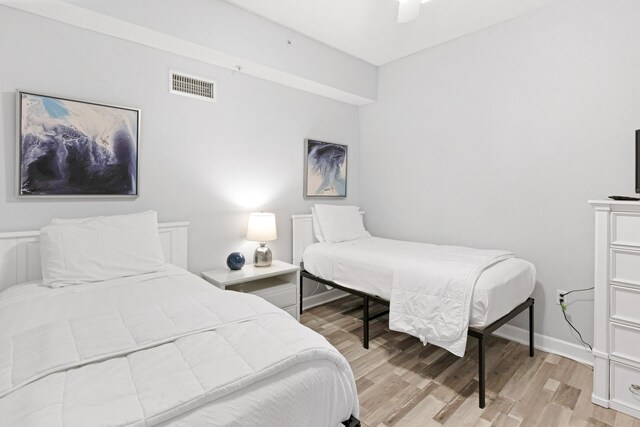 bedroom featuring ceiling fan and light hardwood / wood-style flooring