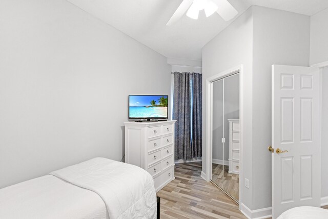 bedroom with a closet, ceiling fan, and light hardwood / wood-style flooring