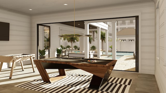 sunroom / solarium featuring billiards