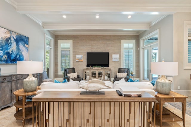 living room with beamed ceiling, plenty of natural light, and crown molding