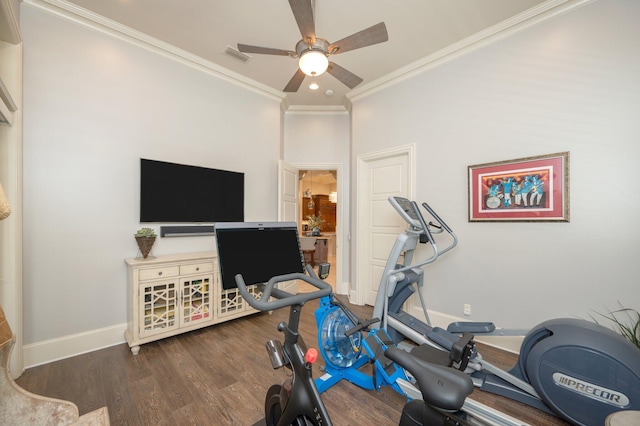 workout area featuring dark hardwood / wood-style floors, ceiling fan, and crown molding