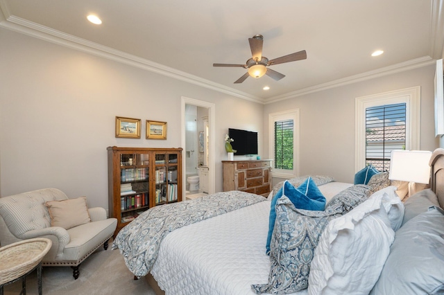 bedroom featuring ensuite bathroom, ceiling fan, and crown molding