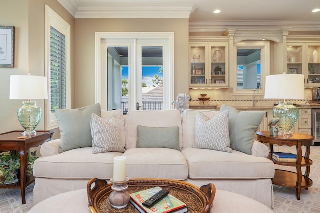 living room featuring beverage cooler and ornamental molding