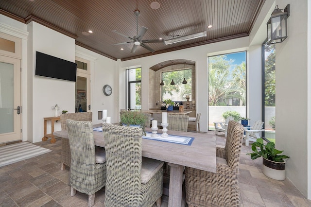 interior space featuring ceiling fan and wood ceiling