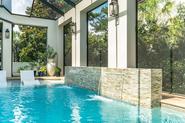 view of pool featuring pool water feature