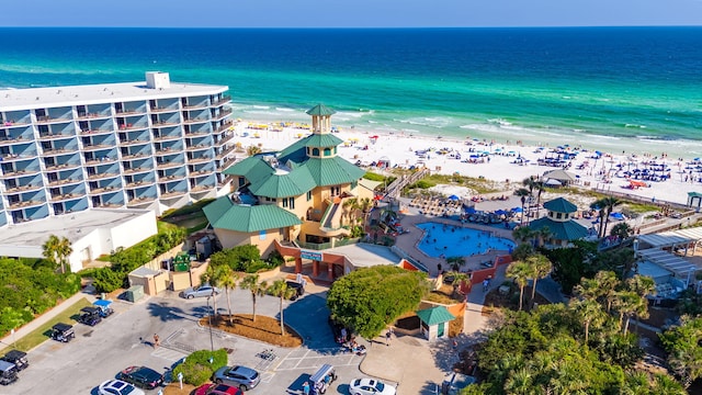 birds eye view of property featuring a water view and a view of the beach