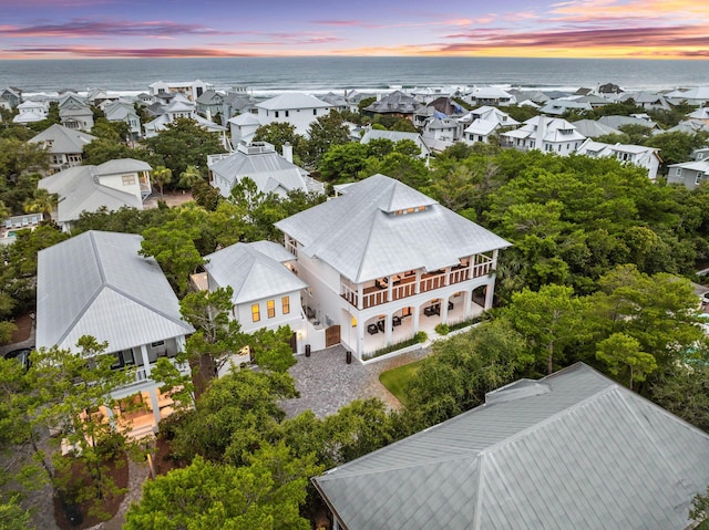 aerial view at dusk with a water view